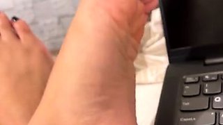 Classy blonde enjoys foot fetish