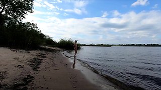 Exhibitionist Blonde Goes Nude on a River Beach