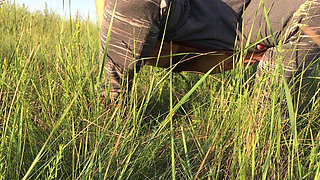 Peeing in the Grass in a Meadow