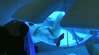 Watch How This German Babe Plays with Her Pussy in Sunbed
