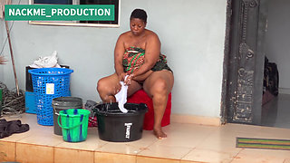 African Mama Multitasks on a Sunday Morning