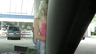 An attractive blonde on the car wash practices sex for