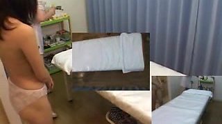 Japanese MILF enjoys an oily massage and fingering