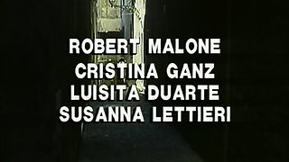 In a kitchen a sexy brunette playing with her big boobs