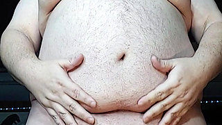 Chubby guy stands and cums