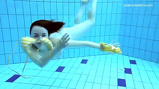 Teen Lada with small tits naked underwater