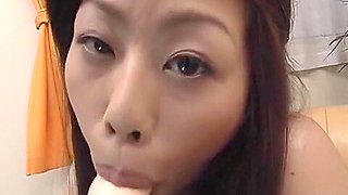 Busty babe Nana Masaki fucks her pussy with big dildos