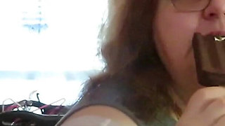 BBW nurse Vicki enjoys eatting a chocolate vanilla ice cream popsiscle