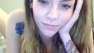 Tattooed Chick fucks her ass with a dildo