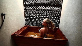 Blonde MILF housewife posing in bikini in the bathroom