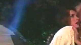A Brunette and a Blonde with Huge Tits Have Sex in Front of the Campfire