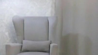 A Woman in an Armchair Satisfies Herself with Her Fingers