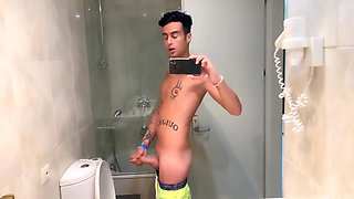 Quick Hotel Bathroom Cumshot Into Sink in Swim Trunks While Friend Is Gone