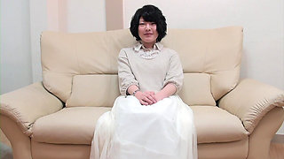 Dark Haired MILF From Asia Playing with a Loaded Pecker