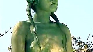 A living nude female Japanese garden statue