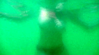 My tits underwater on public beach
