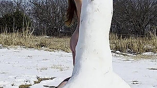 Redhead Slow Strip Rubbing Body on Snow Dick Sculpture