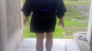 Mature grandmother walking naked outdoors
