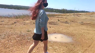 Girl undresses on a windy day