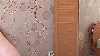 A Busty MILF with a Big Ass in White Panties Behind the Scenes. a Home Camera Watches a Mature Housewife. PAWG.