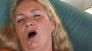 Horny blonde mature shoves remote where sun don't shine