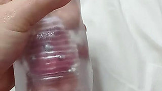 Pierced cock cumming with toy