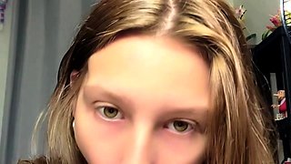 Cute amateur teen girl toying her pussy in bed on cam